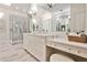 Well-lit, white bathroom with double sinks, marble flooring and a glass shower, providing a spa-like experience at 1418 Waterford Green Dr, Marietta, GA 30068