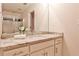 Neutral bathroom featuring a granite countertop, single sink, mirror, and glass shower at 1418 Waterford Green Dr, Marietta, GA 30068