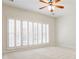 Spacious bedroom is bright with natural light from plantation shutters and offers neutral carpeting at 1418 Waterford Green Dr, Marietta, GA 30068