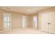 Neutral bedroom with plush carpet, crown molding, plantation shutters, and double door closet at 1418 Waterford Green Dr, Marietta, GA 30068