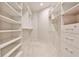 Spacious walk-in closet with custom shelving and storage options, providing an organized wardrobe solution at 1418 Waterford Green Dr, Marietta, GA 30068