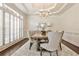 Formal dining room with chandelier, shuttered windows, and elegant decor at 1418 Waterford Green Dr, Marietta, GA 30068