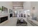 Open-concept living room featuring vaulted ceilings, fireplace, and view of kitchen at 1418 Waterford Green Dr, Marietta, GA 30068