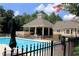 Community pool with a gazebo and ample seating, perfect for summer enjoyment at 1418 Waterford Green Dr, Marietta, GA 30068
