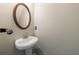 Half-bathroom featuring modern fixtures and a pedestal sink at 2075 Ivy Ln, Union City, GA 30291