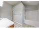 Clean bathroom featuring a tub, shower, tiled floor, and white sink vanity at 2075 Ivy Ln, Union City, GA 30291
