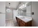 Bright bathroom featuring a large mirror and vanity with drawers and cabinets at 2075 Ivy Ln, Union City, GA 30291