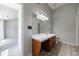 Well lit bathroom featuring a large mirror and vanity with drawers and cabinets at 2075 Ivy Ln, Union City, GA 30291