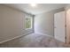 This cozy bedroom offers a plush carpet and a window offering natural light at 2075 Ivy Ln, Union City, GA 30291