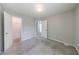 This spacious bedroom offers a plush carpet and a view into the attached closet at 2075 Ivy Ln, Union City, GA 30291