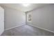 Bedroom featuring plush carpet and a window overlooking the yard at 2075 Ivy Ln, Union City, GA 30291