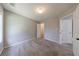This cozy bedroom offers a plush carpet and a view into the attached closet at 2075 Ivy Ln, Union City, GA 30291