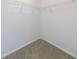 Walk-in closet with metal racks and neutral carpet at 2075 Ivy Ln, Union City, GA 30291
