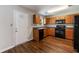 Kitchen featuring black appliances and wooden cabinets at 2075 Ivy Ln, Union City, GA 30291