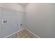 The unfinished laundry room offers a wire rack and washer/dryer hookups at 2075 Ivy Ln, Union City, GA 30291