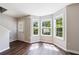 Inviting living area with hardwood floors, large windows, and a view of the front yard at 2075 Ivy Ln, Union City, GA 30291