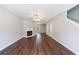 Spacious living room with hardwood floors, fireplace, natural light, and neutral colors at 2075 Ivy Ln, Union City, GA 30291