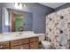 Functional bathroom featuring a vanity with a mirror and a shower at 5534 Blackhawk Dr, Acworth, GA 30102