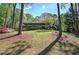 Beautifully landscaped front yard with lush greenery and colorful flowers at 5534 Blackhawk Dr, Acworth, GA 30102