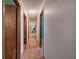 Well-lit hallway with hardwood floors and access to multiple rooms at 5534 Blackhawk Dr, Acworth, GA 30102