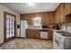 Efficient kitchen with white appliances and ample storage at 5534 Blackhawk Dr, Acworth, GA 30102