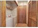 Functional laundry area with washer, dryer, storage shelves and closet space at 5534 Blackhawk Dr, Acworth, GA 30102
