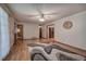 Bright living room featuring hardwood floors, neutral walls, and a ceiling fan at 5534 Blackhawk Dr, Acworth, GA 30102