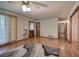 Spacious living room with hardwood floors, a ceiling fan and a lamp on an end table at 5534 Blackhawk Dr, Acworth, GA 30102