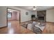 Open living room with hardwood floors, a stone fireplace, and natural light at 5534 Blackhawk Dr, Acworth, GA 30102