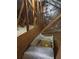 Attic view from inside showing a window and pull-down ladder at 660 Allens Landing Dr, Lawrenceville, GA 30045