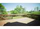 Spacious wooden deck overlooking a lush green backyard with mature trees at 660 Allens Landing Dr, Lawrenceville, GA 30045