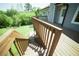 Large wooden deck with stairs leading down to the grassy backyard at 660 Allens Landing Dr, Lawrenceville, GA 30045