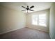 Neutral bedroom featuring large window and ceiling fan at 660 Allens Landing Dr, Lawrenceville, GA 30045