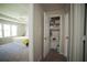 View of bright main bedroom with ceiling fan, with organized closet and shelf space at 660 Allens Landing Dr, Lawrenceville, GA 30045