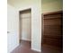 Bedroom closet with shelving and a built-in bookcase at 660 Allens Landing Dr, Lawrenceville, GA 30045
