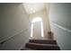 Well-lit entryway with arched doorway and staircase, leading to the upper level at 660 Allens Landing Dr, Lawrenceville, GA 30045
