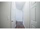 Hallway with wood flooring and neutral colored walls at 660 Allens Landing Dr, Lawrenceville, GA 30045