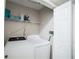 Laundry room featuring a washer and dryer, as well as shelving for storage at 660 Allens Landing Dr, Lawrenceville, GA 30045