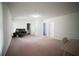 Spacious living room with a bathroom, doors, and wall trim throughout at 660 Allens Landing Dr, Lawrenceville, GA 30045
