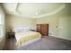 Large main bedroom with a ceiling fan and two wooden dressers for storage at 660 Allens Landing Dr, Lawrenceville, GA 30045