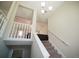 Bright staircase with natural light and a view of the entryway below at 660 Allens Landing Dr, Lawrenceville, GA 30045