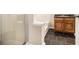 Bathroom featuring dark tile floors, a bathtub, and a vanity with a sink at 680 Barshay Dr, Covington, GA 30016