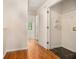 Bright hallway with access to the laundry and hardwood floors at 680 Barshay Dr, Covington, GA 30016