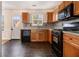 Cozy kitchen with modern appliances, ample cabinet space, and stylish tiled floors at 680 Barshay Dr, Covington, GA 30016