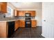 Functional kitchen with wood cabinets, tile backsplash, and modern appliances at 680 Barshay Dr, Covington, GA 30016