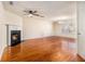 Spacious living room featuring a fireplace, hardwood floors, and plenty of natural light at 680 Barshay Dr, Covington, GA 30016