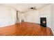 Bright living room with hardwood floors and a cozy fireplace for a comfortable atmosphere at 680 Barshay Dr, Covington, GA 30016