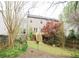Well maintained backyard with deck, fence and mature trees at 988 Vintage Pointe Dr, Lawrenceville, GA 30044
