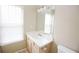 Bathroom with large vanity, sink, mirror and bright window at 988 Vintage Pointe Dr, Lawrenceville, GA 30044