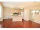 Kitchen and dining area featuring wood floors, pendant lighting, and a breakfast bar at 988 Vintage Pointe Dr, Lawrenceville, GA 30044